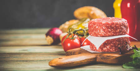Homemade hamburgers on wooden table, close upの写真素材