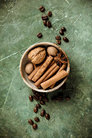 Set of spices and coffee beans on rustic background, flat lay, top viewの写真素材