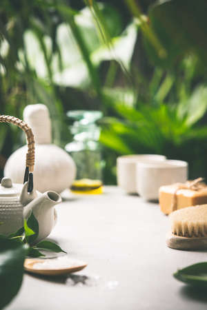 Tea composition on tropical leaves background, close upの写真素材