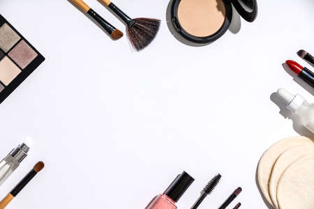Makeup brushes and cosmetic products on a white backgroundの写真素材