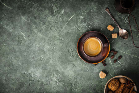 Coffee, flowers and spices on old green backgroundの写真素材