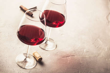 Glasses of red wine on concrete background, copyspaceの写真素材