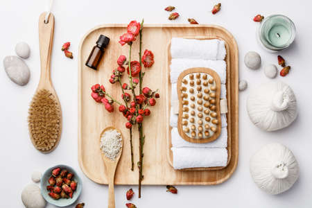 Spa treatment concept, flat lay composition with natural cosmetic products and massage brushesの写真素材