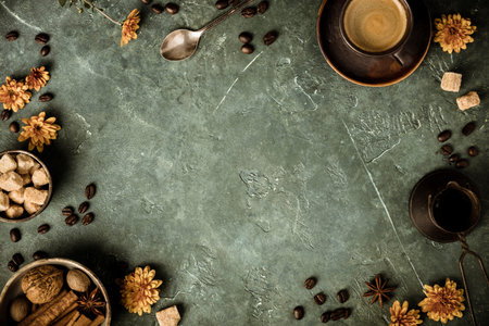 Coffee, flowers and spices on old green backgroundの写真素材