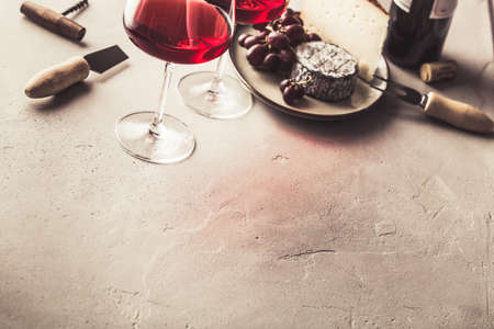 Red wine and cheese on concrete backgroundの写真素材