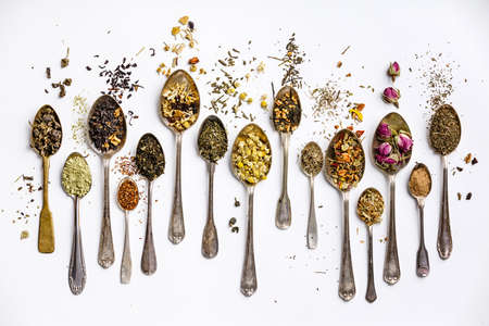 Assortment of dry tea in vintage spoonsの写真素材