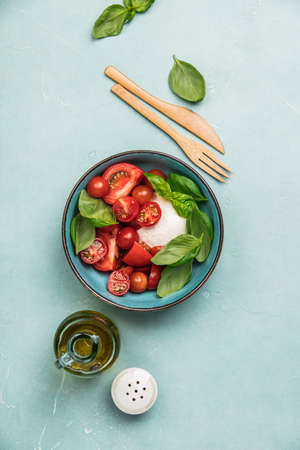 Caprese salad on blue backgroundの写真素材