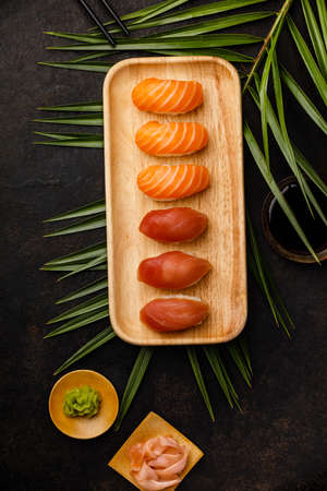 Nigiri sushi set with salmon and tuna served on bamboo plateの写真素材