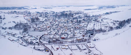 Aerial view of village with residential buildings in winter.の写真素材