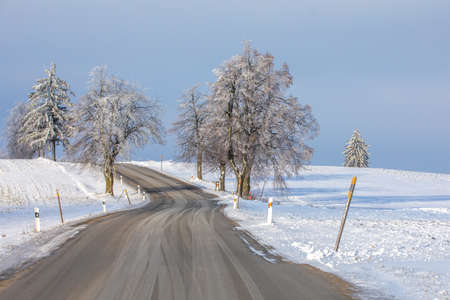 winter landscape with road in highlandの写真素材