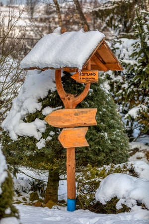 beautiful signpost in winter gardenの写真素材