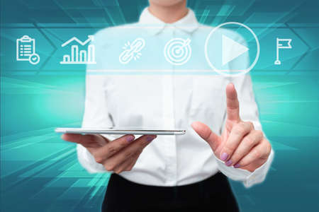 Lady In Uniform Standing Holding Tablet In Hand Pressing Virtual Globe Button. Bussiness Woman Carrying Tab Poining For New Futuristic Technologies.の写真素材