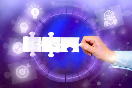 Hand Holding Jigsaw Puzzle Piece Unlocking New Futuristic Technologies.の写真素材