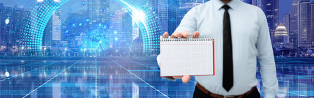 Businessman Holding Empty Notebook Around Futuristic Technology.の写真素材