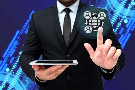 Man In Office Uniform Standing Pressing Virtual Button With Finger Holding Tablet. Gentleman In Business Attire Carrying Tab Pointing New Futuristic Technology.の写真素材