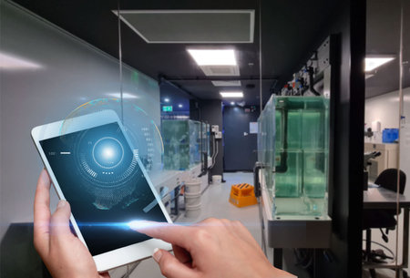 Hand Touching Screen Of Mobile Phone In Laboratory Showing Futuristic Technology S. Finger Tapping...