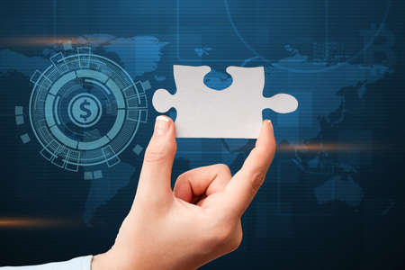 Hand Holding Jigsaw Puzzle Piece Unlocking New Futuristic Technologies. Palm Carrying Puzzles Part Displaying Solving Late Innovative Virtual Ideas.の写真素材
