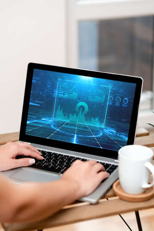 Both Hands Of A Woman Typing On Laptop Beside Coffee Mug And Beautiful Plant Actively Accoumplishing Work From Home. Arm Making New Projects Finishing Remote Jobs.の写真素材