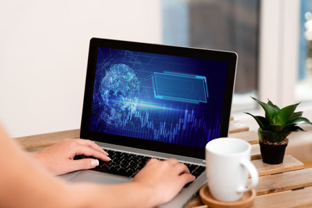 Hand Of Woman Typing On A Laptop Beside Coffee Mug And Beautiful Plant Accomplishing Work From Home. Girl S Arm Making New Projects Finishing Remote Jobs.の写真素材