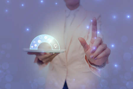 Lady In Uniform Holding Pen Phone With Futuristic Virtual Interface. Business Woman Using Pencil And Mobile Device Interacting With Holographic Display.の写真素材