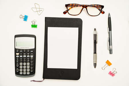 Office Supplies Over Desk With Keyboard And Glasses And Coffee Cup For Working Remotely, Assorted School Utilities For Studying With Hot Drink And Eyeglasses.の写真素材