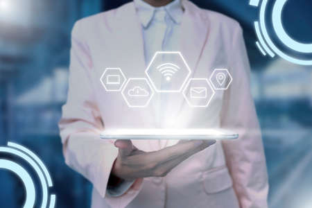 Lady Uniform Standing Tablet Hand Presenting Virtual Modern Technologyの写真素材