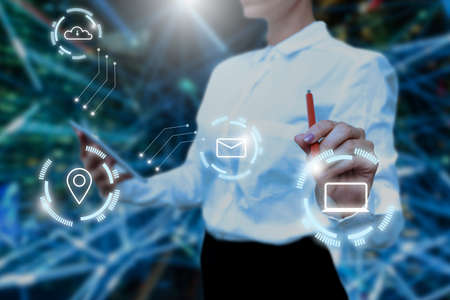 Lady In Uniform Side Standing Holding Tablet In Hand Virtually Typing On Screen. Bussiness Woman Carrying Tab Writing New Futuristic Technologies.の写真素材