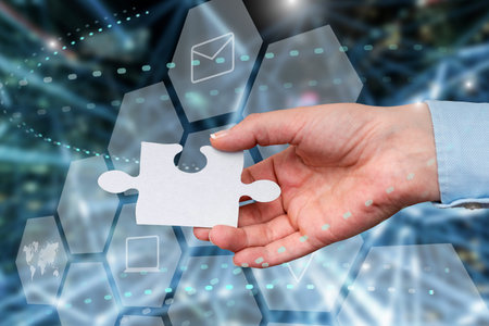 Hand Holding Jigsaw Puzzle Piece Unlocking New Futuristic Technologies. Palm Carrying Puzzles Part...