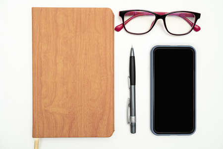 Multiple Assorted Collection Office Stationery Photo With Pens Pencils Notepads Notebook Ruler Stapler Scissors Clippers Paper Clips Holders Clipboard Placed Over Tableの写真素材