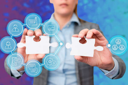 Business Woman Holding Jigsaw Puzzle Piece With Two Hands Unlocking New Futuristic Technologies. Palm Carrying Puzzles Part Displaying Solving Late Innovative Virtual Ideas.の写真素材