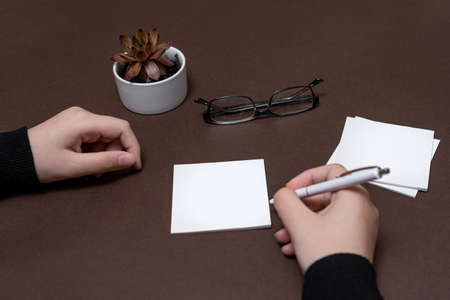 Woman Hand Holding Blank Notes Writing New Messege Updates Ideas. Lady Palm Showing Envelope Folding Sending Letters Post Address.の写真素材