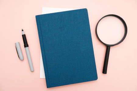 Office Supplies Over Desk With Keyboard And Glasses And Coffee Cup For Working Remotely, Assorted School Utilities For Studying With Hot Drink And Eyeglasses.の写真素材