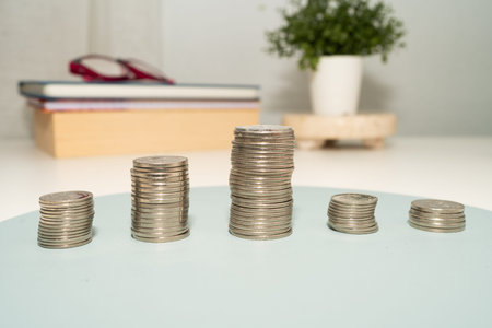 Coins Pile Over The Table Presenting Financial Plans. Mortgage Plans For Home And Office Using...