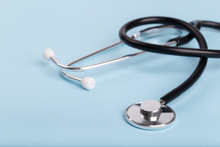 Black stethoscope on tableの写真素材