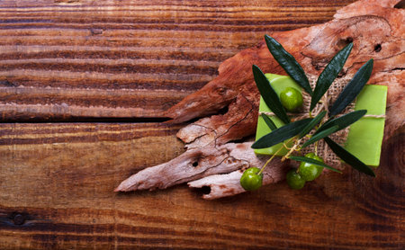 handmade greek olive soap on rustic wooden backgroundの写真素材