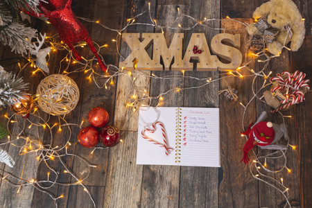 Christmas List on rustic wood with Christmas decorationsの写真素材