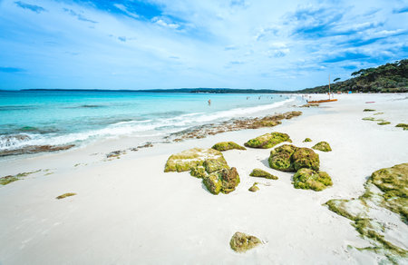 Crowds enjoy the idyllic beach in summerの写真素材
