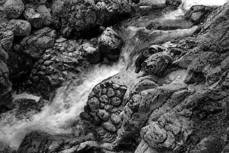 Mountain stream detail, cold freshwater running over rocks and stones