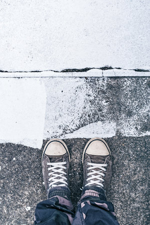Urban city youth lifestyle concept, top view of sneakers on the concrete flooring with white paint...