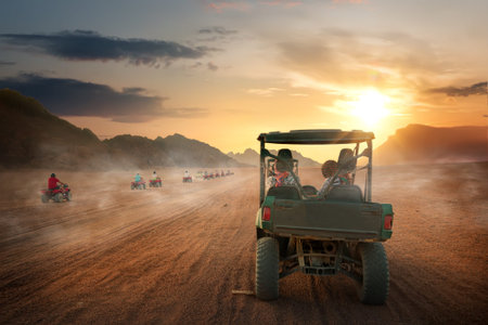 Buggy riding in egyptian desert at sunset, Egypt
