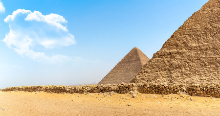 Pyramids of Giza in the desert by dayの写真素材