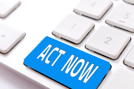 Act now button sign on the keyboard