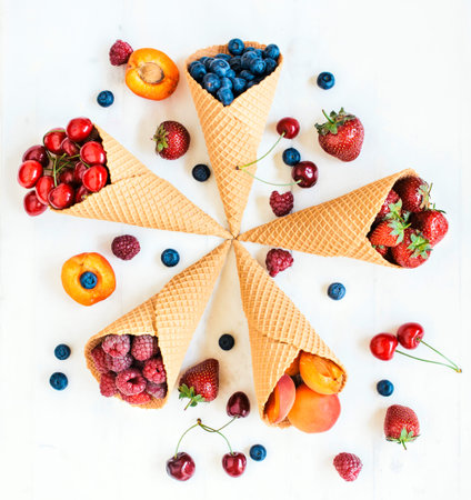 Freshly picked fruits in ice cream cone,selective focus