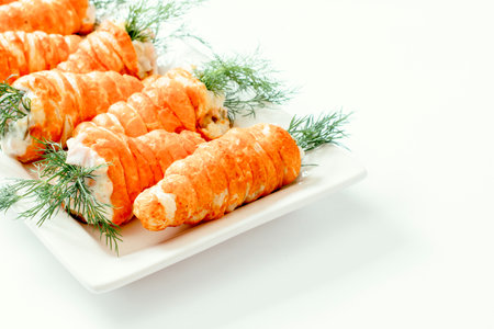Carrots pastry stuffed with salad on white backgroundの写真素材