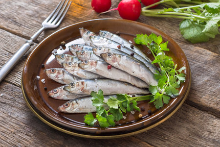 Small fishes called smelt in the plate,selective focus on front part