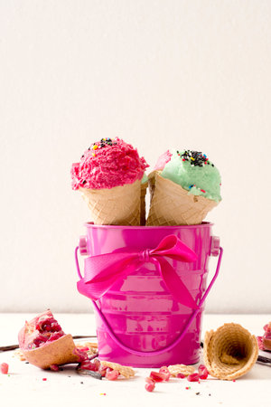 Ice creams in the pink metal basket,high key and blank space