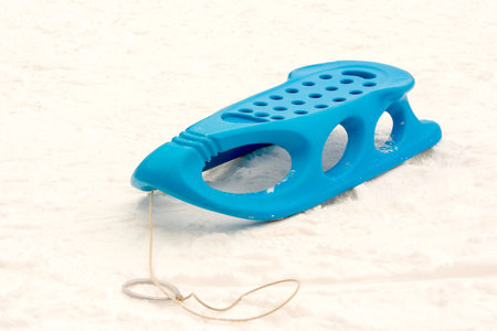 Single blue sled with nobody on snowの写真素材