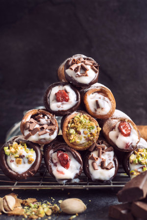 Homemade traditional Sicilian sweet cannoli stuffed ricotta cheese cream,selective focus
