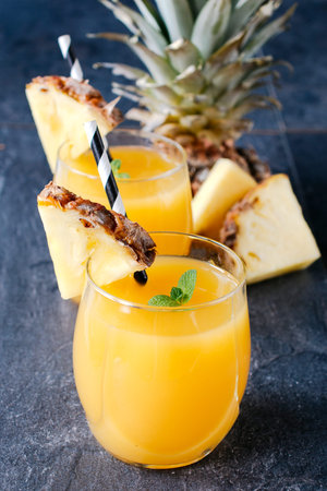 Pineapple juice in the glasses,selective focus..