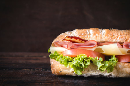 Ciabatta sandwich on wooden background with blank space gor the textの写真素材